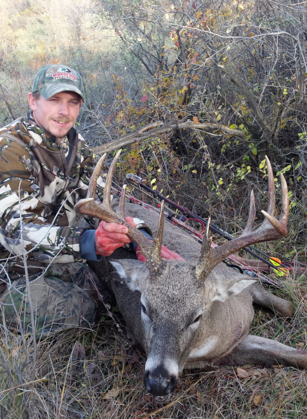 image of nate with 10 pointer he shot with bow